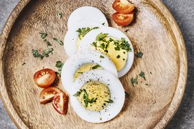 air-fryer-hard-boiled-eggs-hack: hard-boiled eggs with herbs and tomato