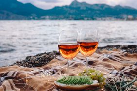 best-winter-spring-wines: two glasses of rosé at the beach
