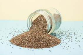 Chia seeds on blue and yellow background