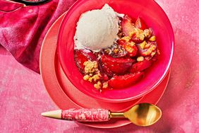A pluot crumble with a scoop of ice cream on top