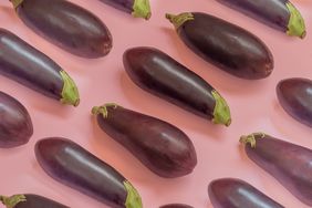 Eggplants on a pink background