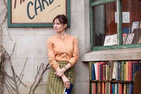 Actress Emily Mortimer stands outside her bookstore in The Bookshop movie