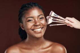 Expensive Makeup Brushes and woman smiling
