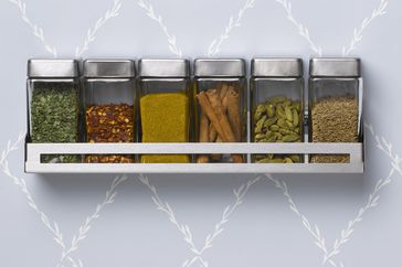 Spice rack hanging on wall