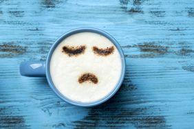 How to Ask Your Boss for a Mental Health Day: coffee cup/sad face