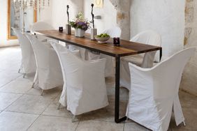 How to Clean Slipcovers, white slipcovers on chairs around dining table