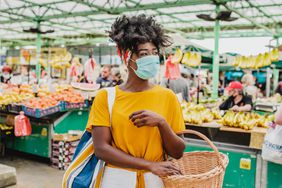 How to shop at farmers markets during coronavirus - woman shopping at market with mask