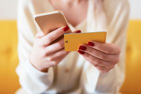 woman using phone to shop online: How to shop online safely
