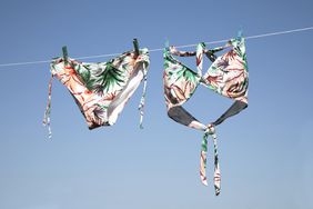 Swimsuits hanging on a line to dry