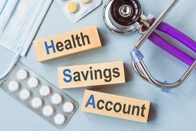 HSA - health savings account symbol, words on wooden blocks. Medical concept.