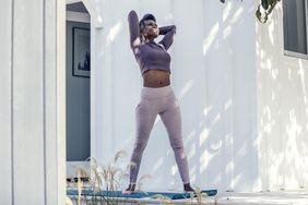 Woman stretching outside at home: working on posture