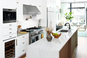 al white kitchen with clean long countertop