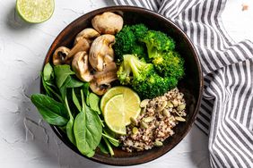 salad made from fresh vegetables broccoli, mushrooms, spinach and quinoa in a bowl. Delicious breakfast or snack, Clean eating, dieting, vegan food concept. top view