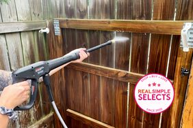 One of the best pressure washers being used to pressure wash a fence.