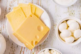 Different types of high-protein cheeses on a table