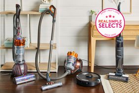 Four of the best vacuums set up next to each other in a living space. 