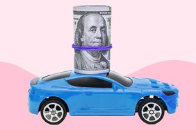 toy car with a roll of dollar bills on top of it