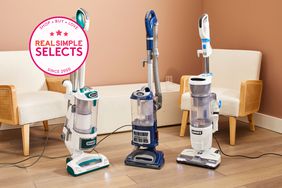Three of the best upright vacuum cleaners on a wood floor with a Real Simple Selects badge. 