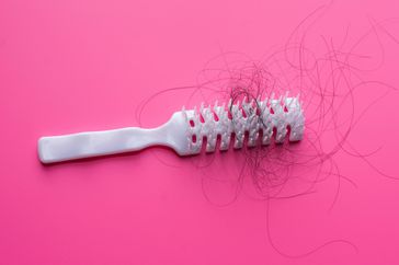 too-much-hair-loss: brush with hair in it