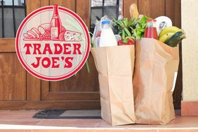 trader joe's shopping bags filled with groceries at front door