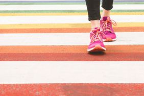 But Why 10,000 Steps? Here’s Where This Daily Fitness Goal Comes From—and If It’s Really Worth Heeding: pink sneakers walking
